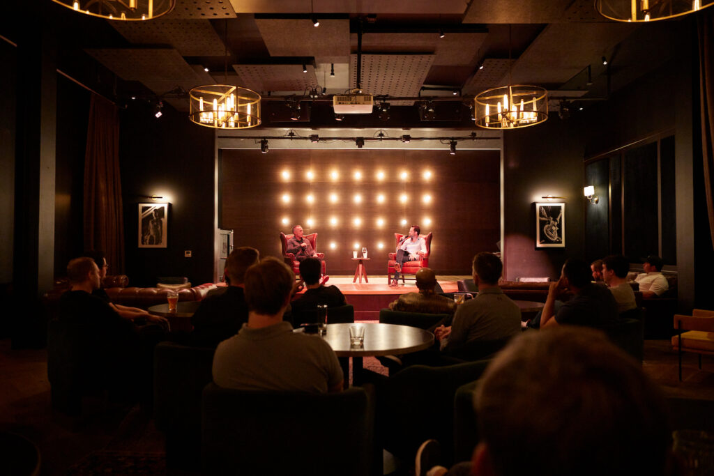 Two Utah operators in conversation on a small stage at a Durable event