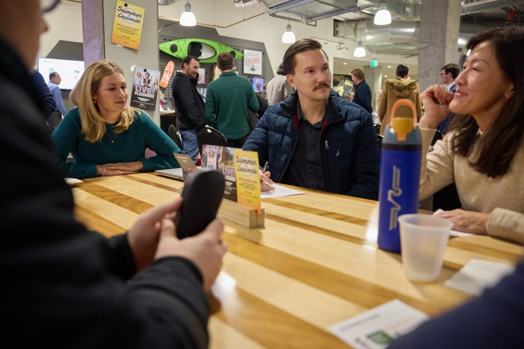 A small group of Utah owners in conversation around a table