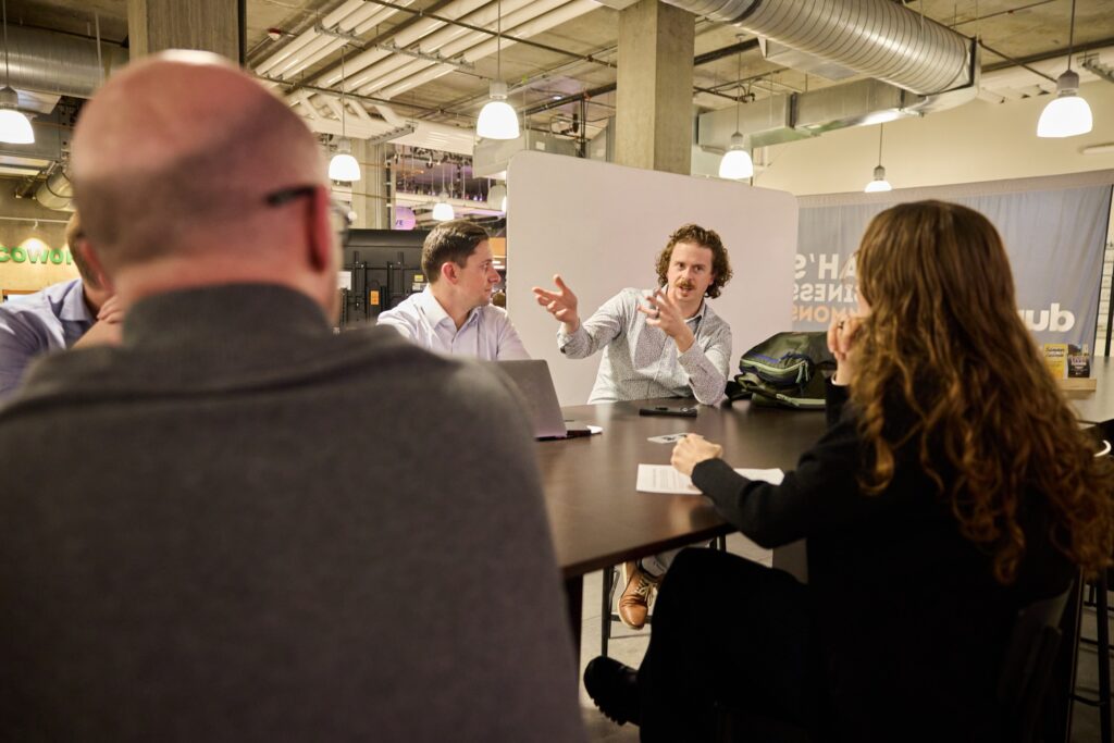 A Durable peer group working through a problem at a roundtable