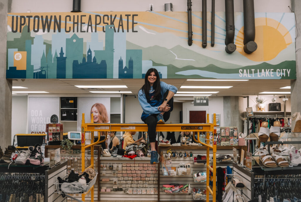 Bella Linchenko in front of a mural she designed for Uptown Cheapskate in Salt Lake City